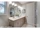 Double vanity bathroom with a large mirror and modern light fixtures at 9927 Cask Way, Huntersville, NC 28078