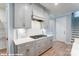 Modern kitchen with gray cabinets, white quartz countertops and gas cooktop at 9927 Cask Way, Huntersville, NC 28078