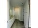 Bathroom with double vanity, tiled floor, and shower at 1058 Bull Dog Ln, Wingate, NC 28174