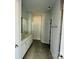 Double vanity bathroom with a large tiled floor and shower at 1058 Bull Dog Ln, Wingate, NC 28174