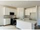 Modern kitchen with white cabinets, quartz countertops, and island at 1058 Bull Dog Ln, Wingate, NC 28174