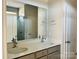 Double vanity bathroom with gray cabinets and a large mirror at 1066 Bull Dog Ln, Wingate, NC 28174