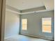 Cozy bedroom with two windows and light gray walls at 1066 Bull Dog Ln, Wingate, NC 28174