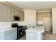 Modern kitchen with gray cabinets, stainless steel appliances, and white quartz countertops at 1066 Bull Dog Ln, Wingate, NC 28174