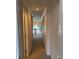 Hallway with carpet and doors to bedrooms, and view of upper level at 11620 Foggy Bank Ln, Charlotte, NC 28214