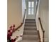 Upstairs hallway with carpet and access to bedrooms at 11620 Foggy Bank Ln, Charlotte, NC 28214