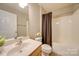 Clean bathroom with shower/tub combo and wood vanity at 11628 Eastwind Dr, Charlotte, NC 28273