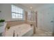 Bathroom with shower/tub combo and tile flooring at 11628 Eastwind Dr, Charlotte, NC 28273
