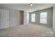 Spacious bedroom with neutral walls and carpet flooring at 11628 Eastwind Dr, Charlotte, NC 28273