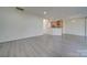 Open dining area with kitchen views and gray vinyl plank floors at 11628 Eastwind Dr, Charlotte, NC 28273
