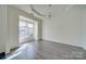 Spacious dining room with hardwood floors and a bay window at 11628 Eastwind Dr, Charlotte, NC 28273