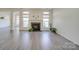 Spacious living room with fireplace and hardwood floors at 11628 Eastwind Dr, Charlotte, NC 28273