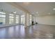 Open living room with hardwood floors and fireplace at 11628 Eastwind Dr, Charlotte, NC 28273