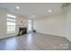 Bright living room with hardwood floors and fireplace at 11628 Eastwind Dr, Charlotte, NC 28273