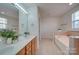 Main bathroom with double vanity, garden tub and shower at 11628 Eastwind Dr, Charlotte, NC 28273