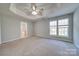 Main bedroom with carpet, ceiling fan, and en-suite bathroom at 11628 Eastwind Dr, Charlotte, NC 28273