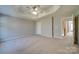 Large main bedroom with carpeted floor and ceiling fan at 11628 Eastwind Dr, Charlotte, NC 28273