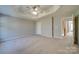 Main bedroom with carpet, ceiling fan, and access to bathroom at 11628 Eastwind Dr, Charlotte, NC 28273