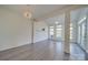 Sunroom features hardwood floors, multiple windows, and a ceiling fan at 11628 Eastwind Dr, Charlotte, NC 28273
