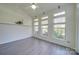 Bright sunroom with hardwood floors and access to backyard at 11628 Eastwind Dr, Charlotte, NC 28273