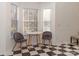 Bright breakfast nook with a checkered floor and two gray chairs at 3004 Redan Ct, Matthews, NC 28105