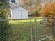 Fenced backyard with shed and Beware of Dog sign at 707 7Th St, Spencer, NC 28159