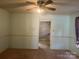 Living room with light blue walls, carpet, and view of kitchen at 707 7Th St, Spencer, NC 28159