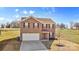 Two-story house with a driveway and surrounding green space at 109 Vintage Woods Ln, Shelby, NC 28150