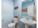 Powder room with light blue walls and a pedestal sink at 109 Vintage Woods Ln, Shelby, NC 28150