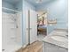 Bathroom with shower, double vanity, and view into bedroom at 109 Vintage Woods Ln, Shelby, NC 28150