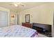 Bedroom with queen bed, dresser, ceiling fan and access to upper level at 109 Vintage Woods Ln, Shelby, NC 28150