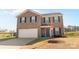 Two-story brick house with a two-car garage and landscaping at 109 Vintage Woods Ln, Shelby, NC 28150