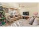Living room with two couches, a Christmas tree, and a flat-screen TV at 109 Vintage Woods Ln, Shelby, NC 28150