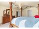 Main bedroom with four-poster bed, dresser, and ceiling fan at 109 Vintage Woods Ln, Shelby, NC 28150