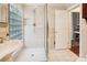 Bathroom with glass shower enclosure, built-in sink, and a view into another room at 1202 Brook Dr, Lancaster, SC 29720