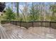 Spacious wooden deck overlooking a wooded backyard at 1202 Brook Dr, Lancaster, SC 29720