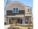 Two-story home with neutral siding and a large front yard at 12217 Lady Bell Dr, Charlotte, NC 28278