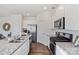 Modern kitchen with white cabinets, granite countertops and stainless steel appliances at 12217 Lady Bell Dr, Charlotte, NC 28278