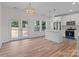 Modern kitchen with white cabinets, a large island, and hardwood floors at 1238 Miller Chapel Rd, Salisbury, NC 28147