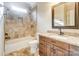 Bathroom with granite vanity, tiled shower, and soaking tub at 12539 Overlook Mountain Dr, Charlotte, NC 28216