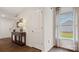 Entryway with hardwood floors, coat closet, and a console table at 14529 Winged Teal Rd, Charlotte, NC 28278