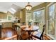 Charming kitchen nook with a round table and chairs, offering views to the backyard at 15001 Chilgrove Ln, Huntersville, NC 28078