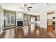 Spacious living room with hardwood floors, fireplace, and view to kitchen at 15405 Canmore St, Charlotte, NC 28277