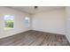 Bright bedroom with hardwood floors and two windows at 18016 Wilbanks Dr, Charlotte, NC 28278