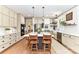 Modern kitchen with white shaker cabinets, quartz countertops, and a large island at 208 Grey Rd, Davidson, NC 28036