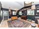 Bright music room with built-in shelving and hardwood floors at 208 Grey Rd, Davidson, NC 28036