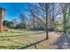 Large backyard with mature trees providing shade at 3143 Whitson Rd, Gastonia, NC 28054