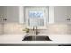 Modern kitchen sink and faucet with white quartz countertop at 3631 Maple Glenn Ln, Charlotte, NC 28226