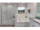 Modern bathroom with a walk-in shower, soaking tub, and granite countertop at 4198 Steel Way, Sherrills Ford, NC 28673