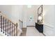 Elegant staircase with black metal railing and wood steps at 4225 Steel Way, Sherrills Ford, NC 28673